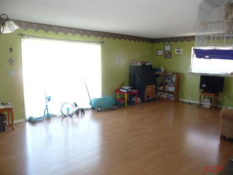 4213 Rigel Avenue Lompoc, CA 93436 - Photo 6 of 13 a living room with furniture and a wooden floor