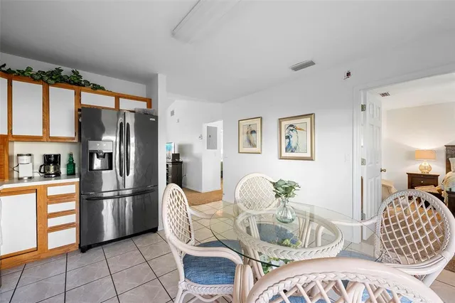 a living room with furniture fireplace and a large window