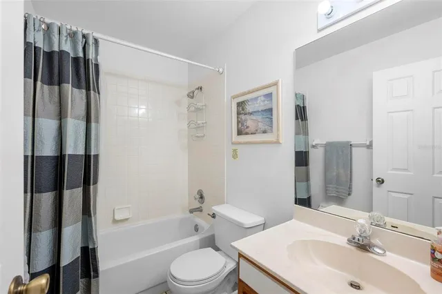 a bedroom with a bed and a table