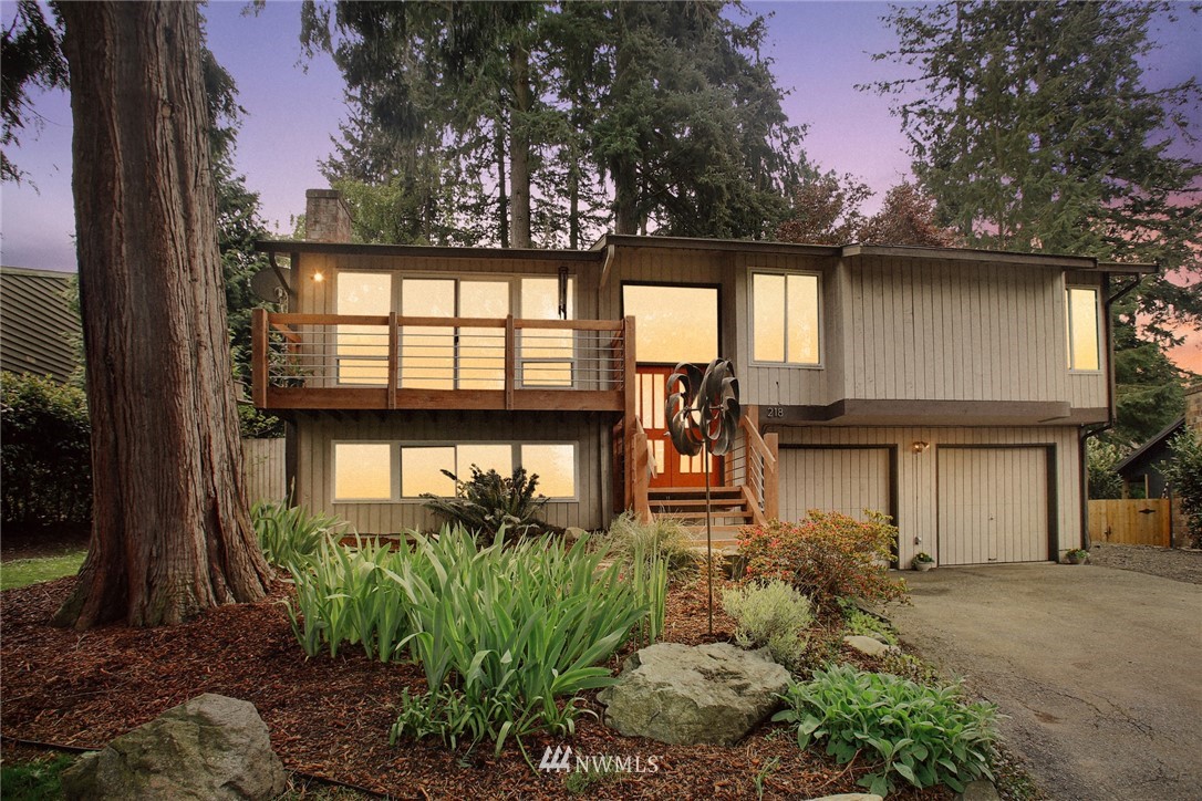 218 221st Street Southwest Bothell, WA 98021 - Photo 2 of 40 a front view of a house with a yard