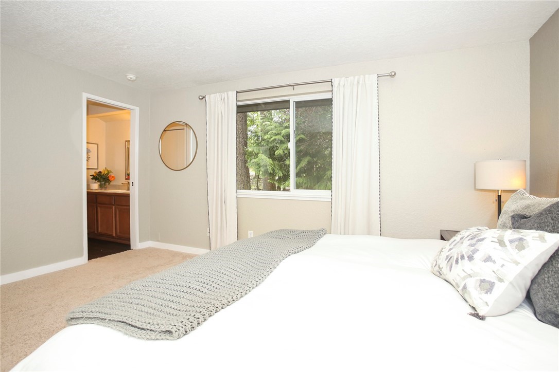 218 221st Street Southwest Bothell, WA 98021 - Photo 14 of 40 a bedroom with a bed and a window