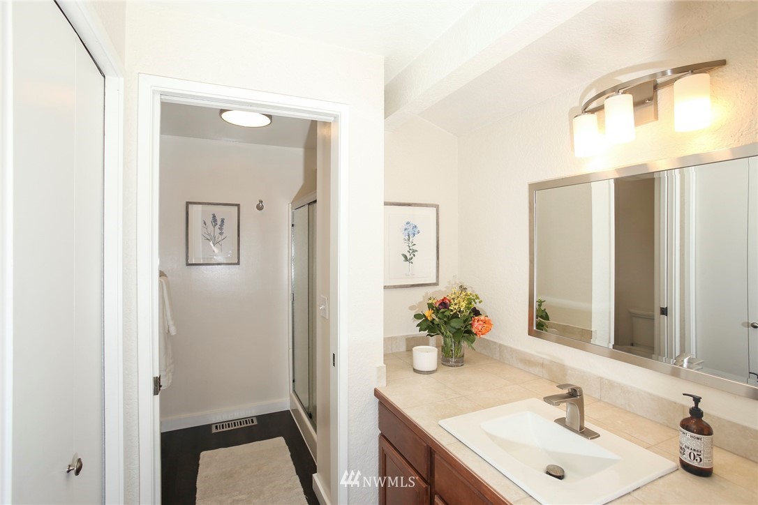 218 221st Street Southwest Bothell, WA 98021 - Photo 15 of 40 a bathroom with a sink and a mirror