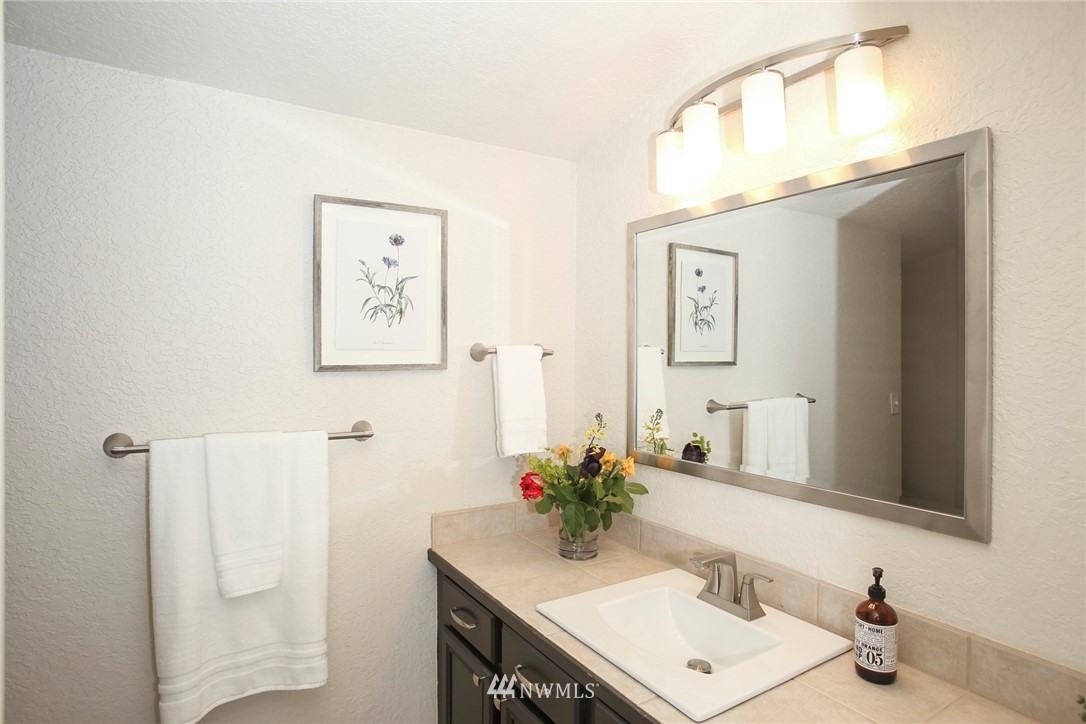 218 221st Street Southwest Bothell, WA 98021 - Photo 18 of 40 a bathroom with a sink vanity and a mirror