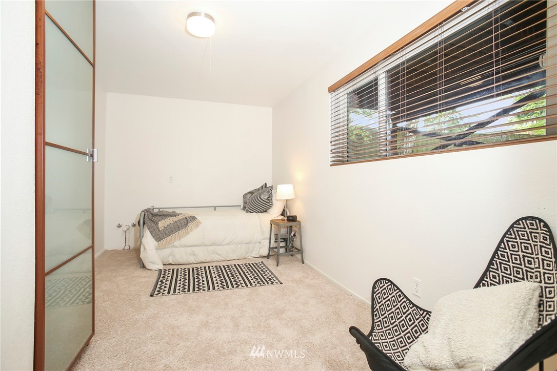 218 221st Street Southwest Bothell, WA 98021 - Photo 19 of 40 a bedroom with furniture and a window