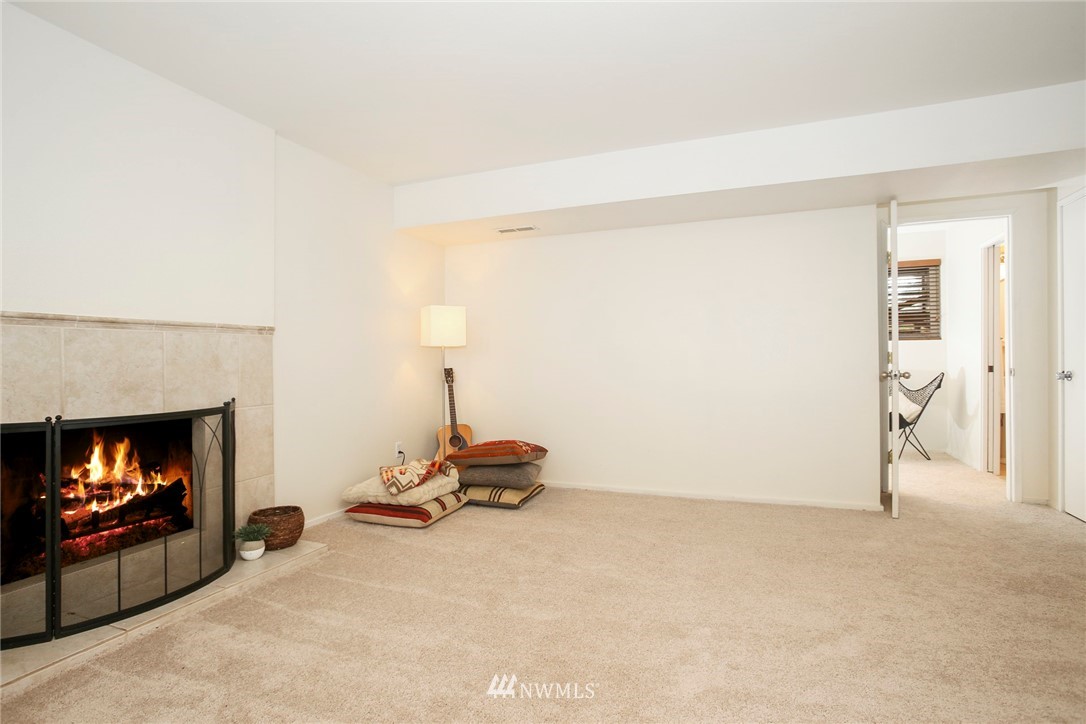 218 221st Street Southwest Bothell, WA 98021 - Photo 21 of 40 a living room with furniture and a fireplace