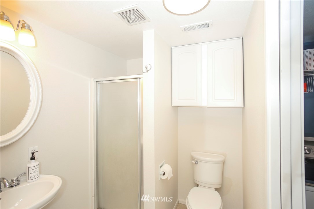 218 221st Street Southwest Bothell, WA 98021 - Photo 23 of 40 a bathroom with a toilet sink and mirror