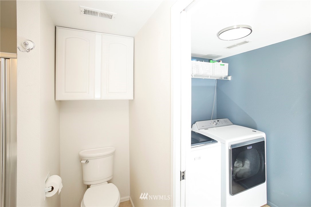 218 221st Street Southwest Bothell, WA 98021 - Photo 24 of 40 a bathroom with a toilet sink and mirror