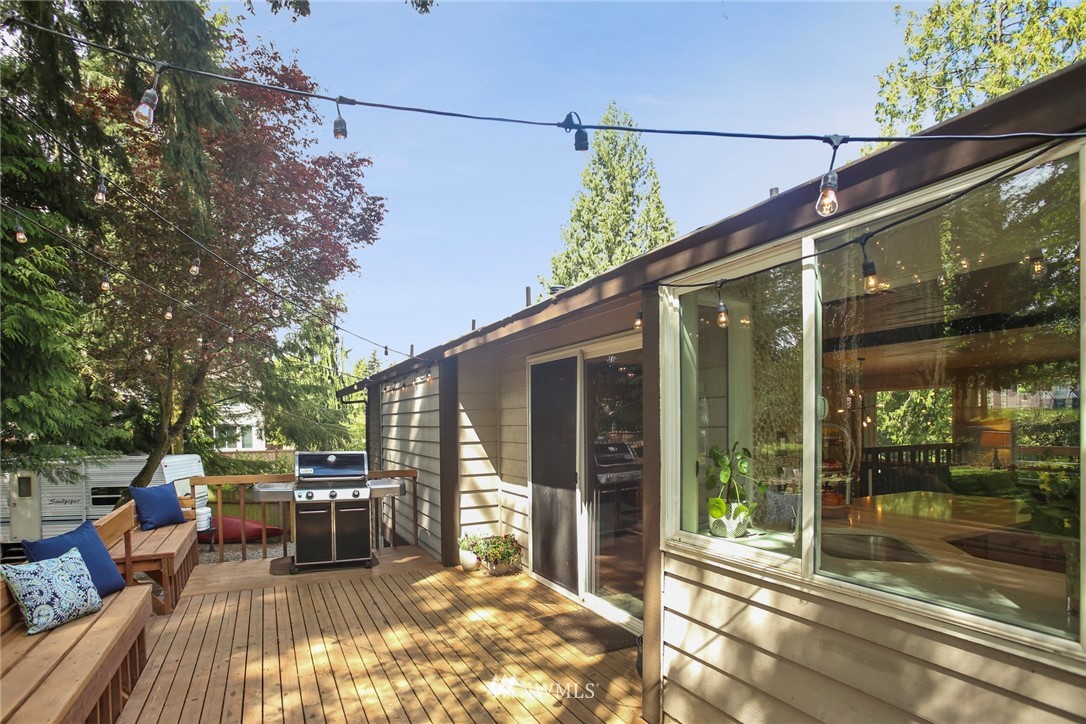 218 221st Street Southwest Bothell, WA 98021 - Photo 28 of 40 a view of a patio with table and chairs and wooden floor