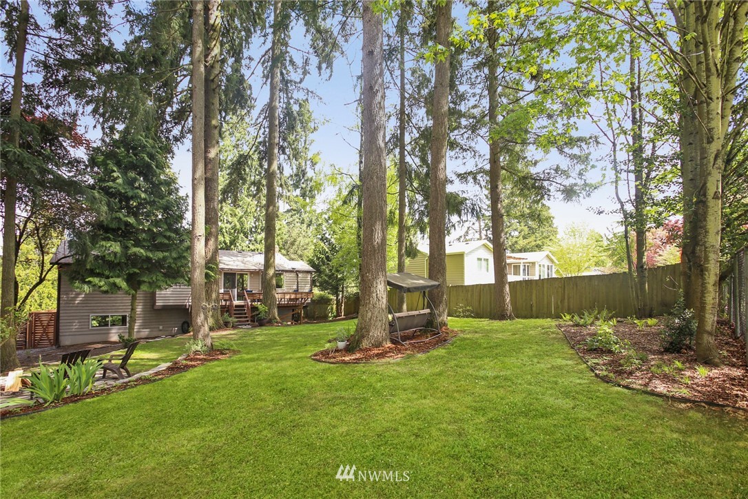 218 221st Street Southwest Bothell, WA 98021 - Photo 35 of 40 a backyard of a house with lots of green space and fountain