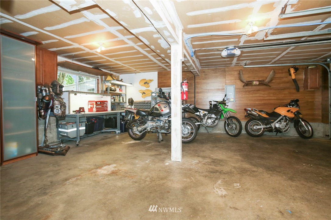 218 221st Street Southwest Bothell, WA 98021 - Photo 38 of 40 a view of a garage with a bike and white car