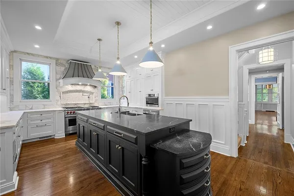 a kitchen that has a lot of cabinets in it