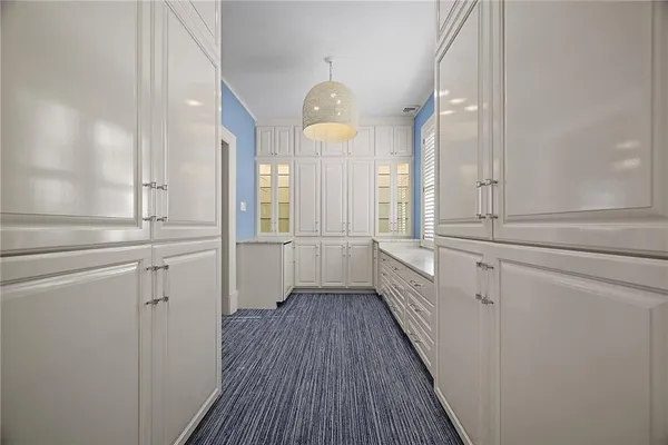 a bathroom with a granite countertop sink a toilet and shower