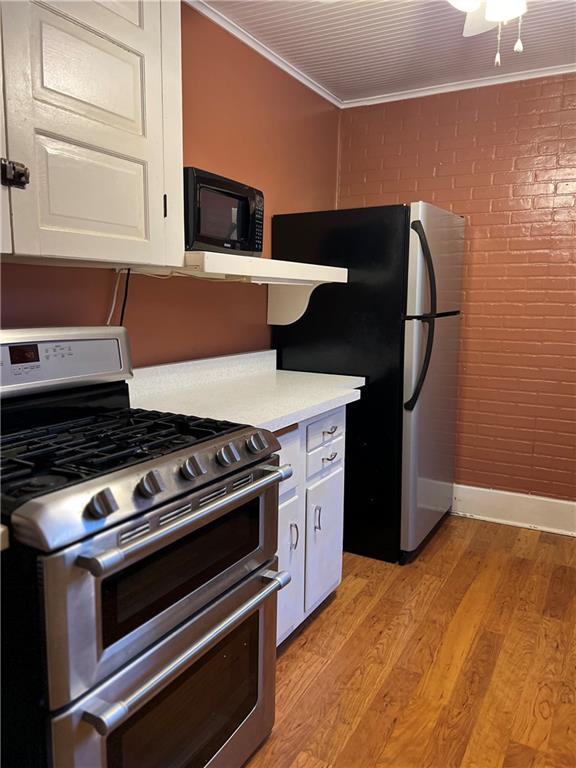 263 Whitestown Road Butler, PA 16001 - Photo 14 of 44 a kitchen with a stove and a microwave