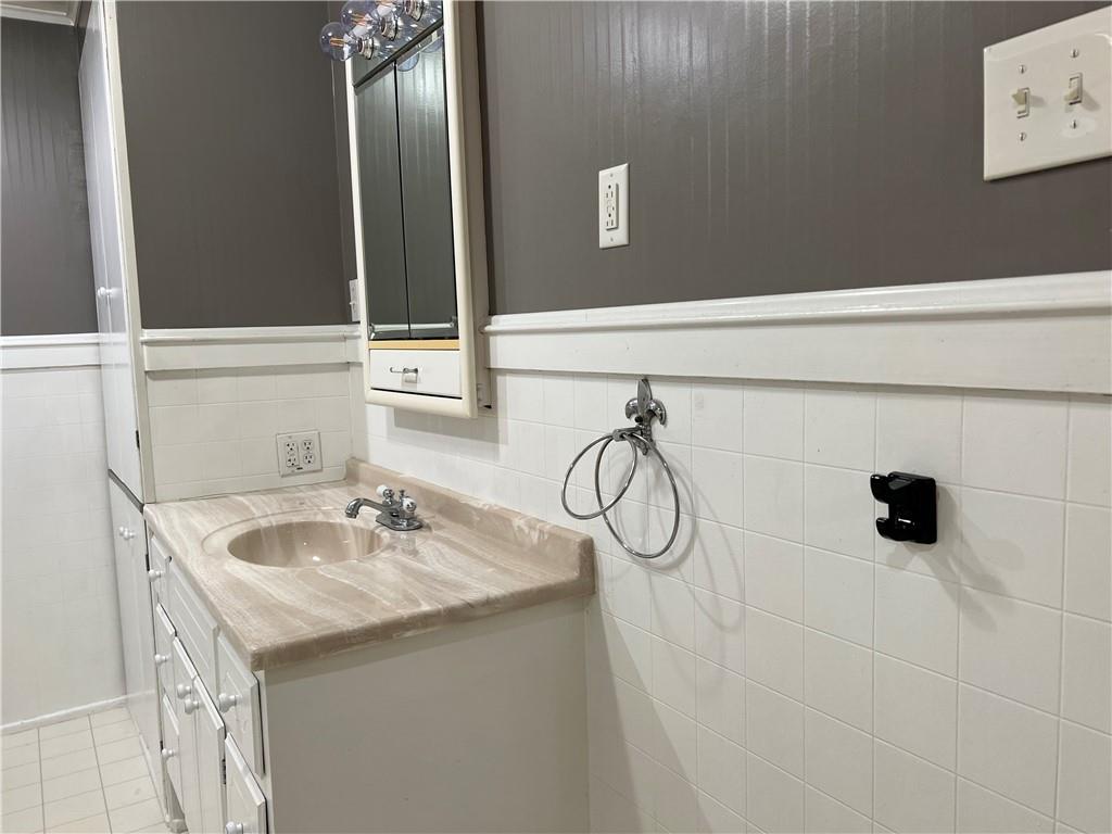 263 Whitestown Road Butler, PA 16001 - Photo 27 of 44 a bathroom with a sink and a mirror
