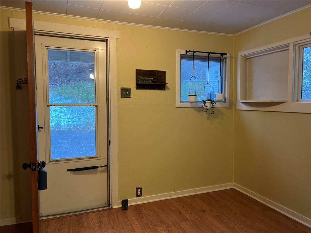 263 Whitestown Road Butler, PA 16001 - Photo 43 of 44 a view of an empty room with wooden floor and a window
