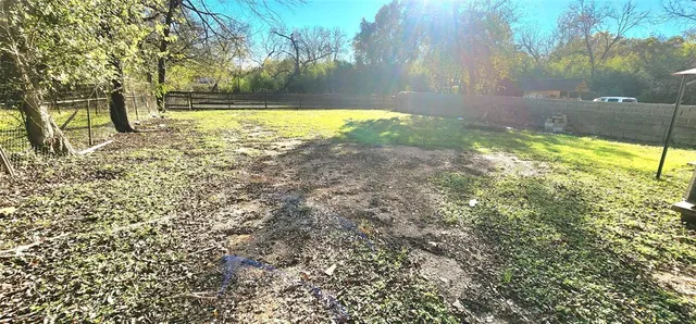 a view of swimming pool from a yard