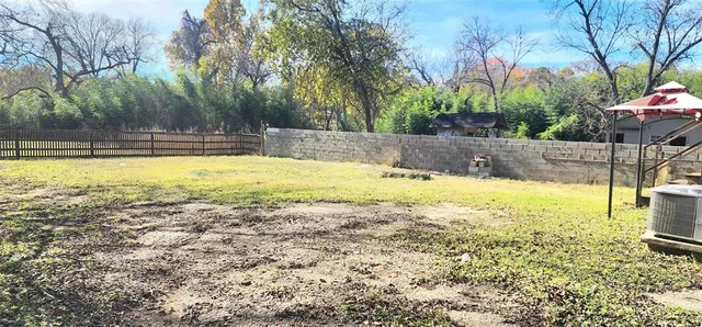 a view of a swimming pool with an outdoor space and seating area