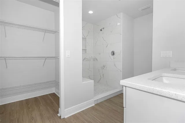 a bathroom with a sink and shower