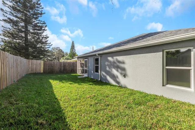 a view of a back yard of the house