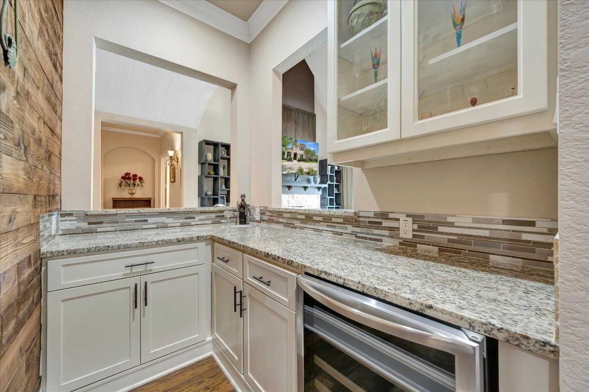 3108 Tyler Court Friendswood, TX 77546 - Photo 14 of 50 a kitchen with a sink and cabinets