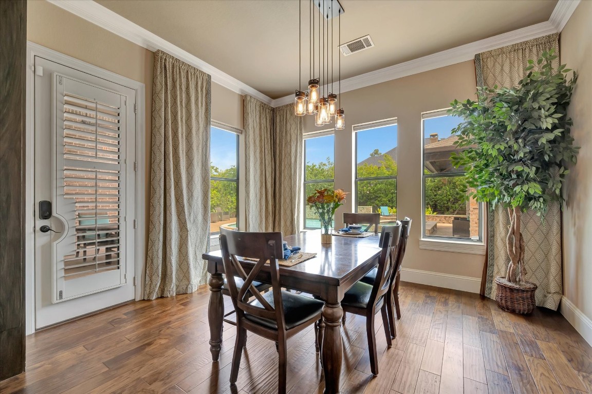 3108 Tyler Court Friendswood, TX 77546 - Photo 18 of 50 a view of a dining room with furniture window and wooden floor