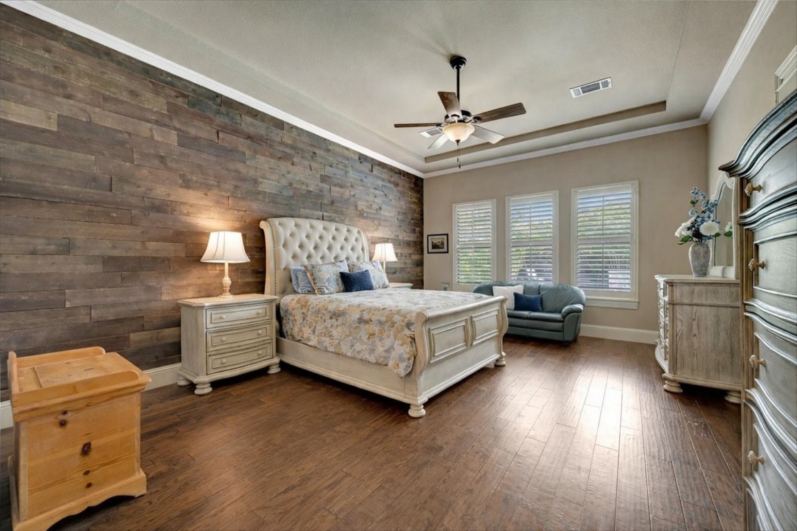 3108 Tyler Court Friendswood, TX 77546 - Photo 19 of 50 a bedroom with a bed and a chandelier