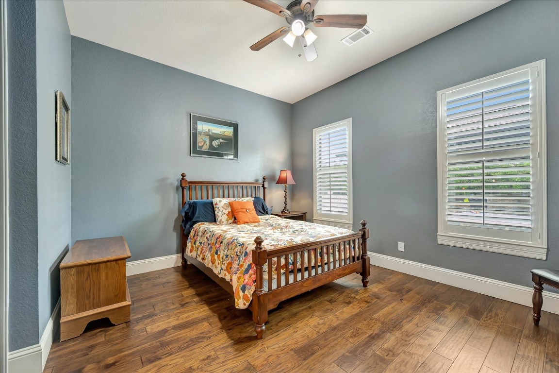 3108 Tyler Court Friendswood, TX 77546 - Photo 23 of 50 a bedroom with a bed lamp and a window