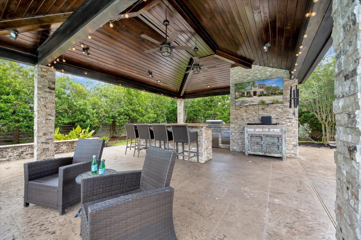 3108 Tyler Court Friendswood, TX 77546 - Photo 3 of 50 a view of a patio with a table chairs and backyard