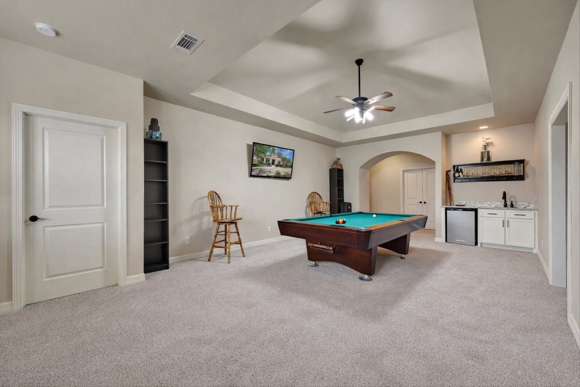 3108 Tyler Court Friendswood, TX 77546 - Photo 34 of 50 a living room with furniture and a chandelier