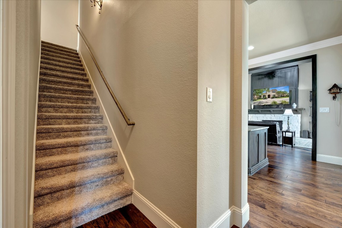 3108 Tyler Court Friendswood, TX 77546 - Photo 41 of 50 a view of a hallway with wooden floor and staircase