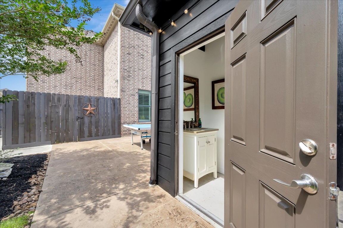 3108 Tyler Court Friendswood, TX 77546 - Photo 44 of 50 a view of a house with a wooden door