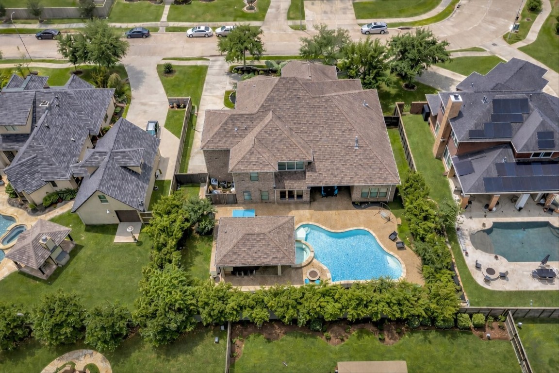 3108 Tyler Court Friendswood, TX 77546 - Photo 47 of 50 an aerial view of a house with garden space and lake view