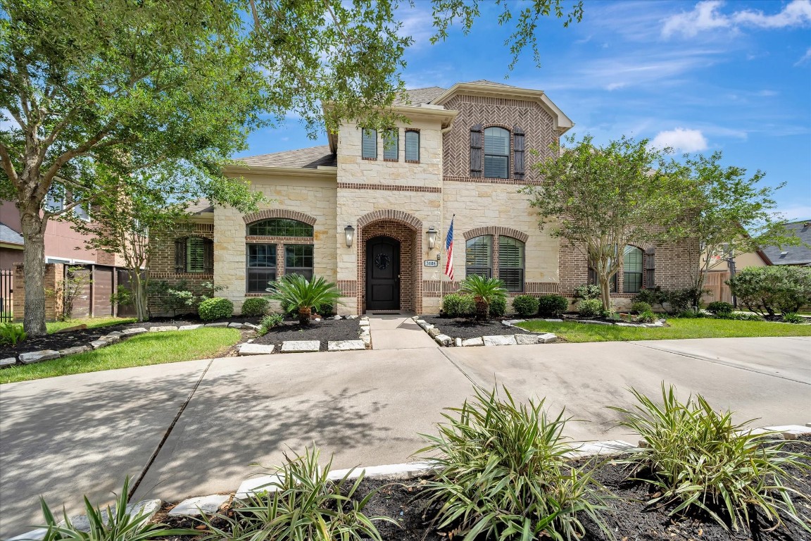 3108 Tyler Court Friendswood, TX 77546 - Photo 50 of 50 a front view of a house with garden and porch