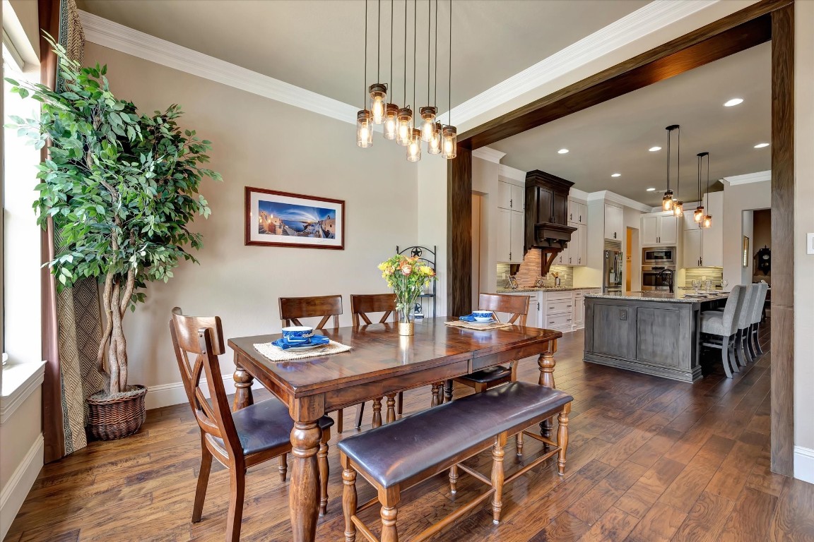 3108 Tyler Court Friendswood, TX 77546 - Photo 6 of 50 a view of a dining room with furniture and wooden floor