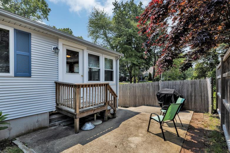 9 Uncle Henrys Road Mashpee, MA 02649 - Photo 11 of 41 a view of a chair in backyard of the house