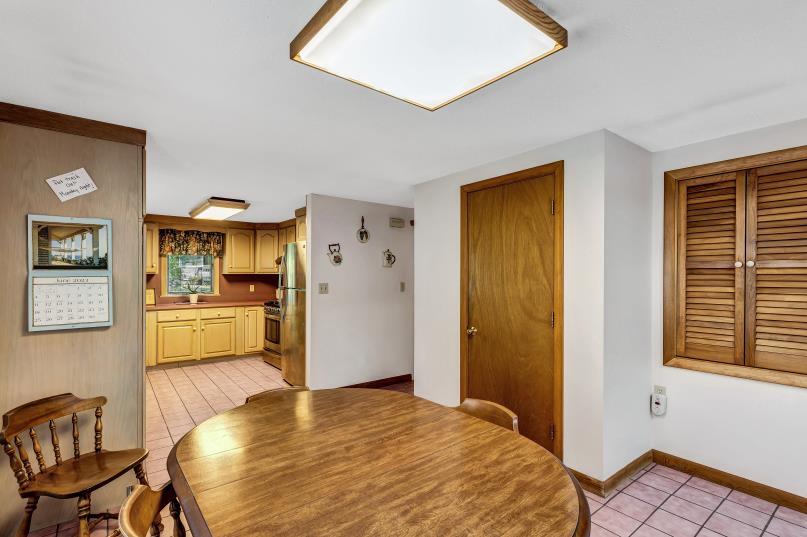 9 Uncle Henrys Road Mashpee, MA 02649 - Photo 16 of 41 a bedroom with a bed and a view of kitchen