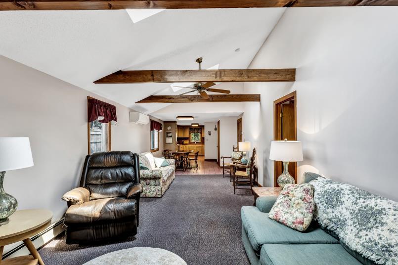 9 Uncle Henrys Road Mashpee, MA 02649 - Photo 19 of 41 a living room with furniture and a chandelier