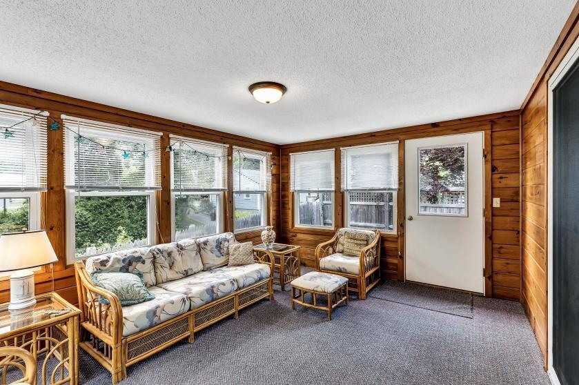 9 Uncle Henrys Road Mashpee, MA 02649 - Photo 23 of 41 a living room with furniture and large windows
