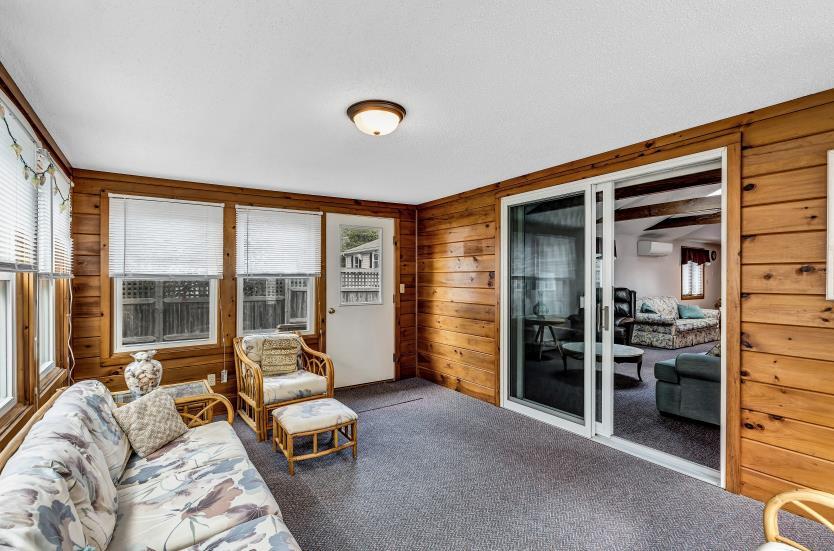 9 Uncle Henrys Road Mashpee, MA 02649 - Photo 24 of 41 a living room with furniture and large windows