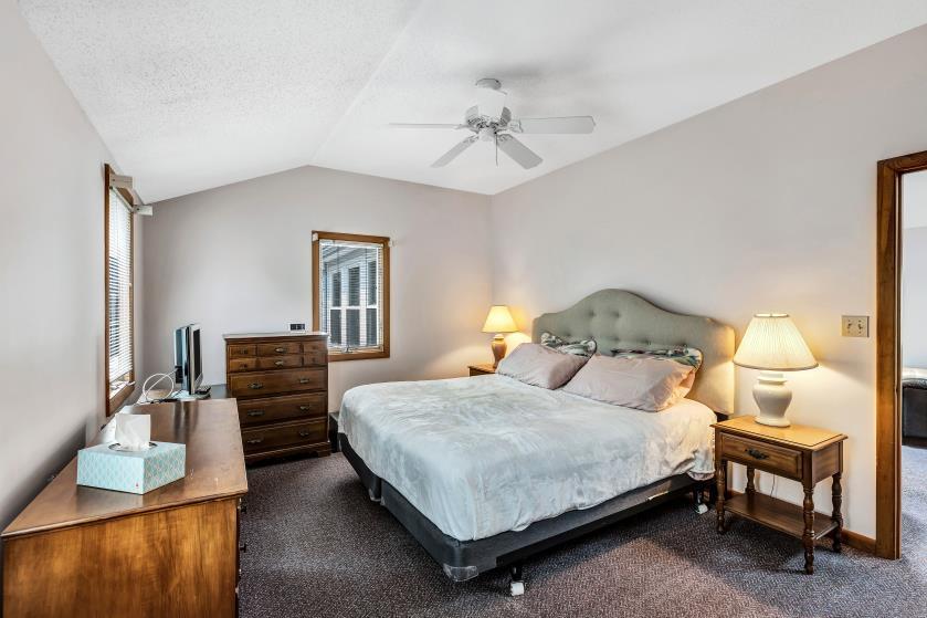 9 Uncle Henrys Road Mashpee, MA 02649 - Photo 25 of 41 a bedroom with a bed and wooden floor