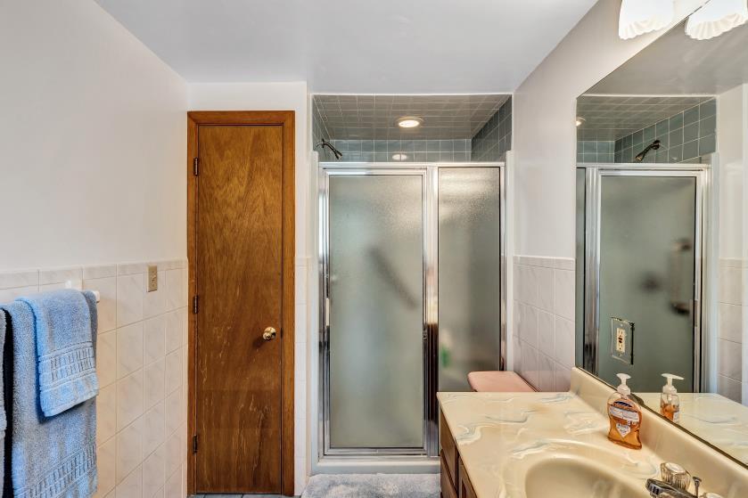 9 Uncle Henrys Road Mashpee, MA 02649 - Photo 31 of 41 a bathroom with a tub shower and sink