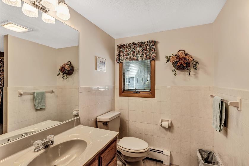 9 Uncle Henrys Road Mashpee, MA 02649 - Photo 34 of 41 a bathroom with a toilet sink and mirror