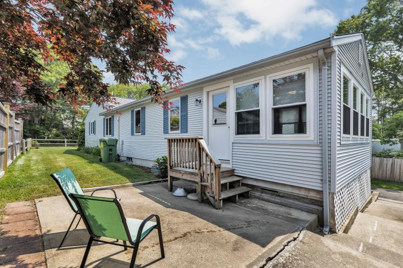 9 Uncle Henrys Road Mashpee, MA 02649 - Photo 10 of 41 a view of a house with backyard sitting area and garden
