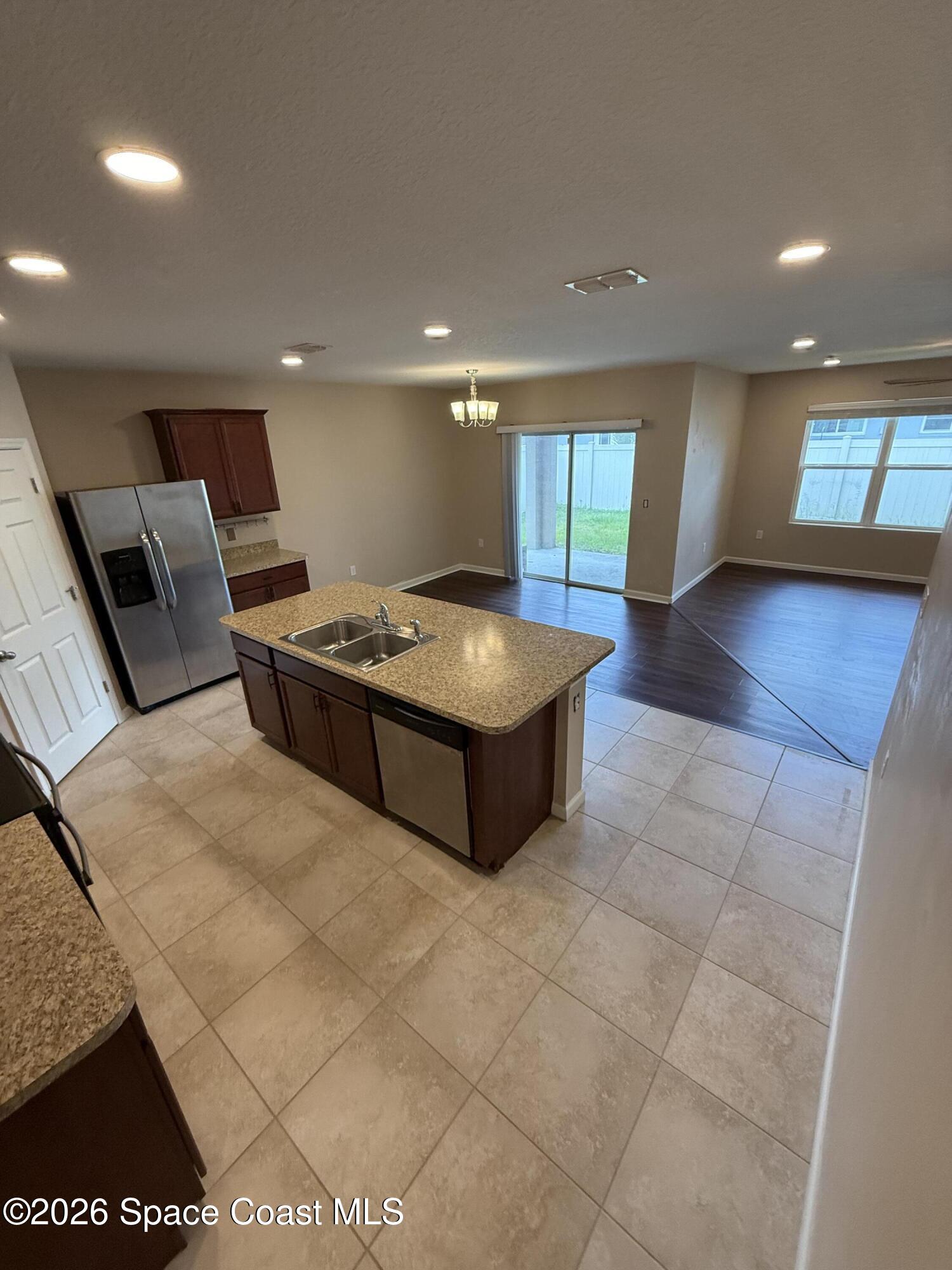 1070 Swiss Pointe Lane Rockledge, FL 32955 - Photo 7 of 18 a living room with furniture and a rug