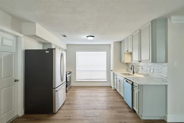 a bathroom with a double vanity sink and mirror