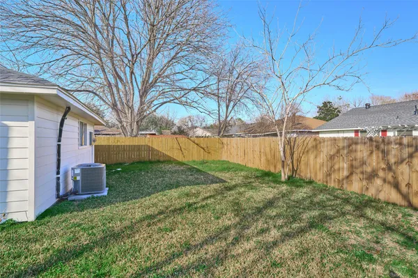 a backyard of a house with lots of green space