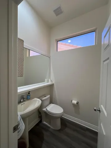 a utility room with sink dryer and washer