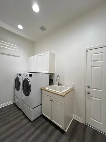 a room with furniture and painting on the wall