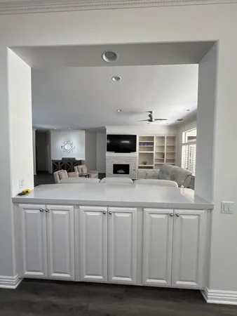 a kitchen with a sink and a stove top oven
