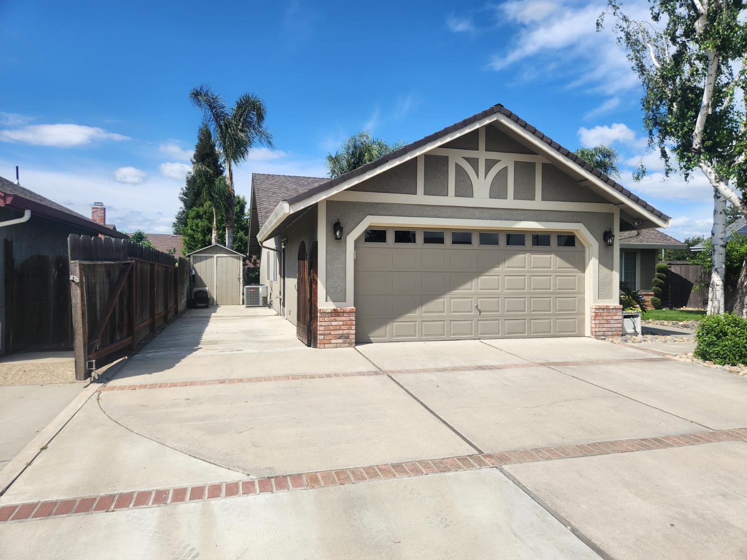 777 Jordanolo Drive Ripon, CA 95366 - Photo 51 of 61 a front view of a house with a yard and garage